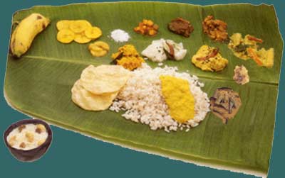 Serving Onam Sadya,Onasadhya,Onam Feast,vegetarian feast,tender banana plantain leaves,Plastic leaf,Pappadam,Rice,parippu curry,Ghee,Sambar,Kalan,Rasam,Pulisseri,buttermilk,Adapradhaman